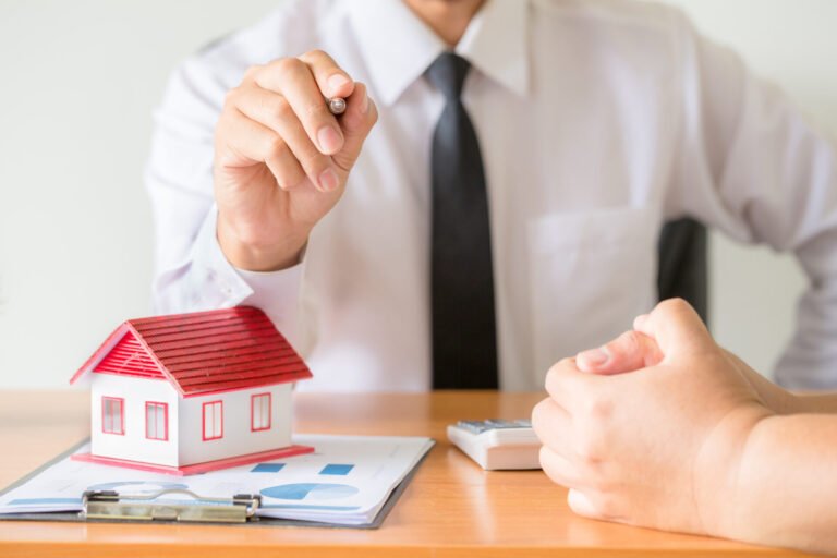 Home salesman stretches holding black pen