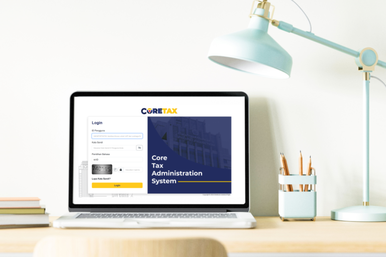 A laptop displaying the Coretax DJP login page, representing Indonesia's tax report transition to the Coretax system.