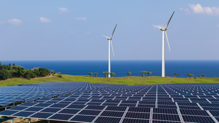 Solar panels and wind turbines illustrating renewable energy advancements, a key focus in Indonesia Industrial Growth in 2025.