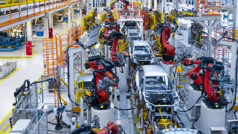 Robotic arms assembling vehicles in a modern automotive manufacturing facility in Indonesia, showcasing Indonesia’s Automotive Investment and its role in driving industry growth and innovation.