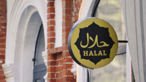 A halal certification sign on a restaurant's exterior, representing the importance of halal compliance for businesses. Halal Expo 2025 aims to support companies in obtaining halal certification to expand their market reach.