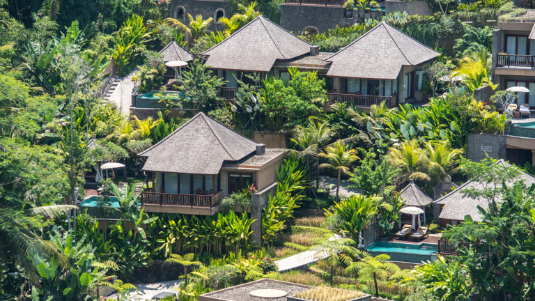 Traditional villas surrounded by lush greenery in Bali, highlighting opportunities and common mistakes when starting a business.