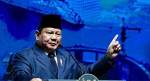 Prabowo giving a speech on Indonesia’s infrastructure development at the 2025 Infrastructure Conference in Central Jakarta.