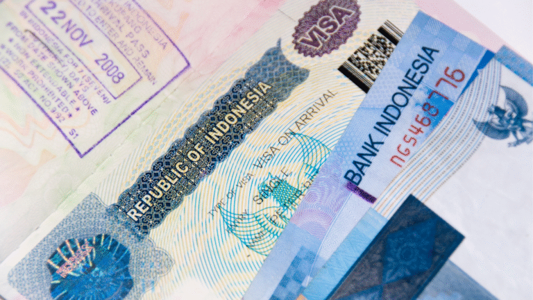 Close-up of an Indonesian visa and passport stamp showing travel documents symbolyzing Indonesia visa requirements 2025.