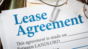 Lease agreement document with a paperclip, representing legal terms and financial commitments involved in leasing in Indonesia.