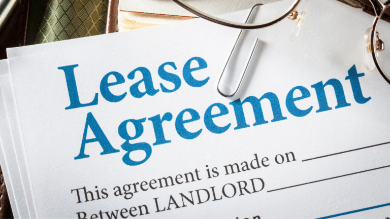 Lease agreement document with a paperclip, representing legal terms and financial commitments involved in leasing in Indonesia.