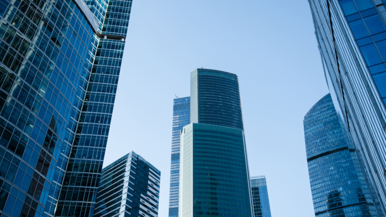 Modern glass skyscrapers in Jakarta’s central business district, representing corporate growth and business opportunities for PT PMA Indonesia companies.