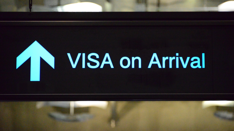 Visa on Arrival sign in an airport symbolizing Indonesia visa requirements in 2026